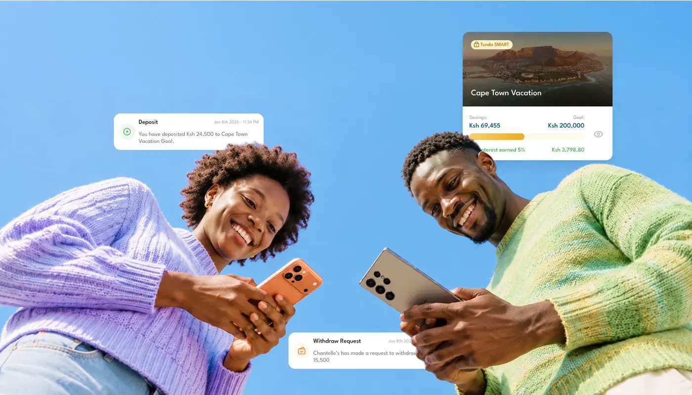 Friends looking at their phones while saving together